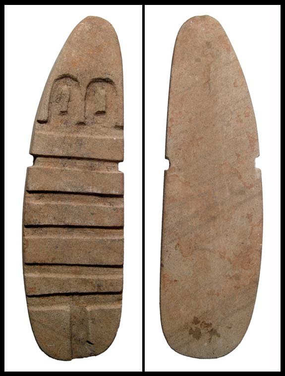 Valdivian carved limestone figure, Ecuador: A Valdivian carved limestone abstract figure, Ecuador, c.2300 - 2000 BC. This light grayish-green limestone "idol" is tabular in form, depicted with large incised eyes with raised pupils. H: 8 5/8" (2