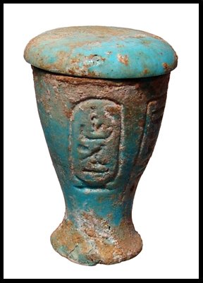 Faience lidded vessel, cartouches of Nectanebo II: A faience lidded vessel with cartouches of Nectanebo II, c.362 - 343 BC. Nice light blue color with some surface encrustation. Intact, minor chip to foot. H: 1 11/16" (4.2 cm). Ex Moss Auctions, Austr