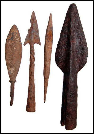 Group of Roman iron spear and arrow heads: A group of Roman iron spear and arrow heads, c.1st - 3rd Century AD. The first is a large well-preserved iron spear point, L: 5 ¼" (13.4 cm) and the other three pieces are iron arrowheads including a
