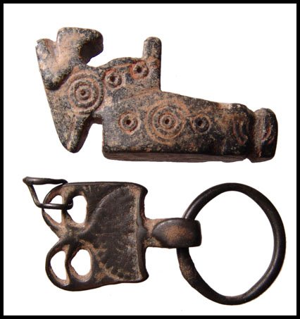 2 items: Near Eastern stone pipe, Yemeni bronze: A lot of 2 pieces. The first is a Near Eastern stone pipe, c.1st Millennium BC, in the form of a horned goat. The body is decorated with circular devices. Intact with age deposits. L: 1 7/8" (4.9 cm).