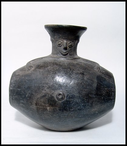 Unusual "intoxicated" Inca figural vessel, Peru: An unusual Inca figural vessel from Peru, c. AD 1300 - 1500, depicting an individual climbing out of a large vat. His head is nicely detailed, with the large eyes indicating a state of intoxication an