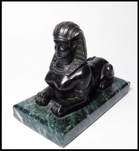 Grand Tour. An attractive reclining sphinx: Grand Tour. An attractive reclining sphinx, early 20th Century. Very nicely modeled in painted dark metal, the style of the 1910's & 1920's, wearing nemes head cloth and broad collar, a stylized eleme