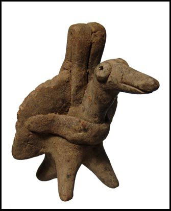 Cute bird whistle from Colima, West Mexico: A cute bird whistle from Colima, West Mexico, ca. 300 BC - AD 300. Hand modeled with large circular eyes, stylized wings and peg legs. Old repair to beak and neck and old collection label on back. H: