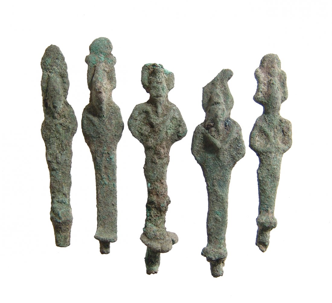 A lot of 5 Egyptian bronze votive figures of Osiris: A lot of 5 Egyptian bronze votive figures of Osiris, Late Period, c. 664 - 332 BC, each depicted mummiform, wearing Atef crown with uraeus and false bead, arms folded over chest and holding a crook an