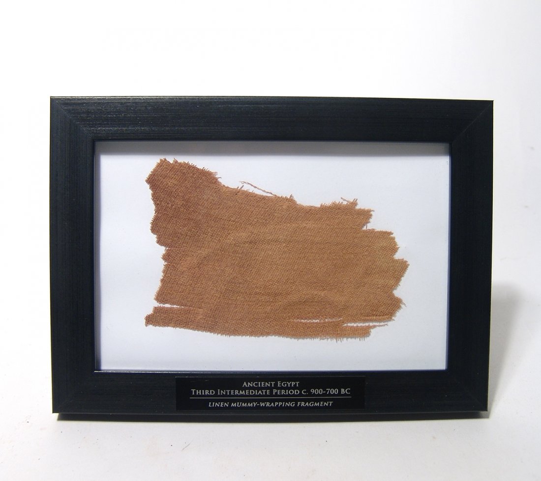 A large piece of Egyptian linen-wrapping: A large piece of Egyptian linen-wrapping, 3rd Intermediate Period, c. 900 - 700 BC. Tan to brown in color, with dark stains from the resins and oils used during the mummification practice. Nicely pres
