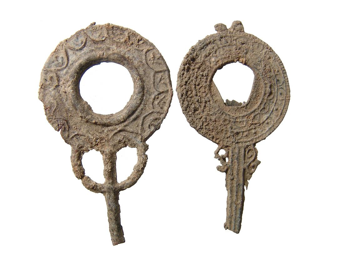 A pair of Roman lead votive hand mirrors (1 of 2)