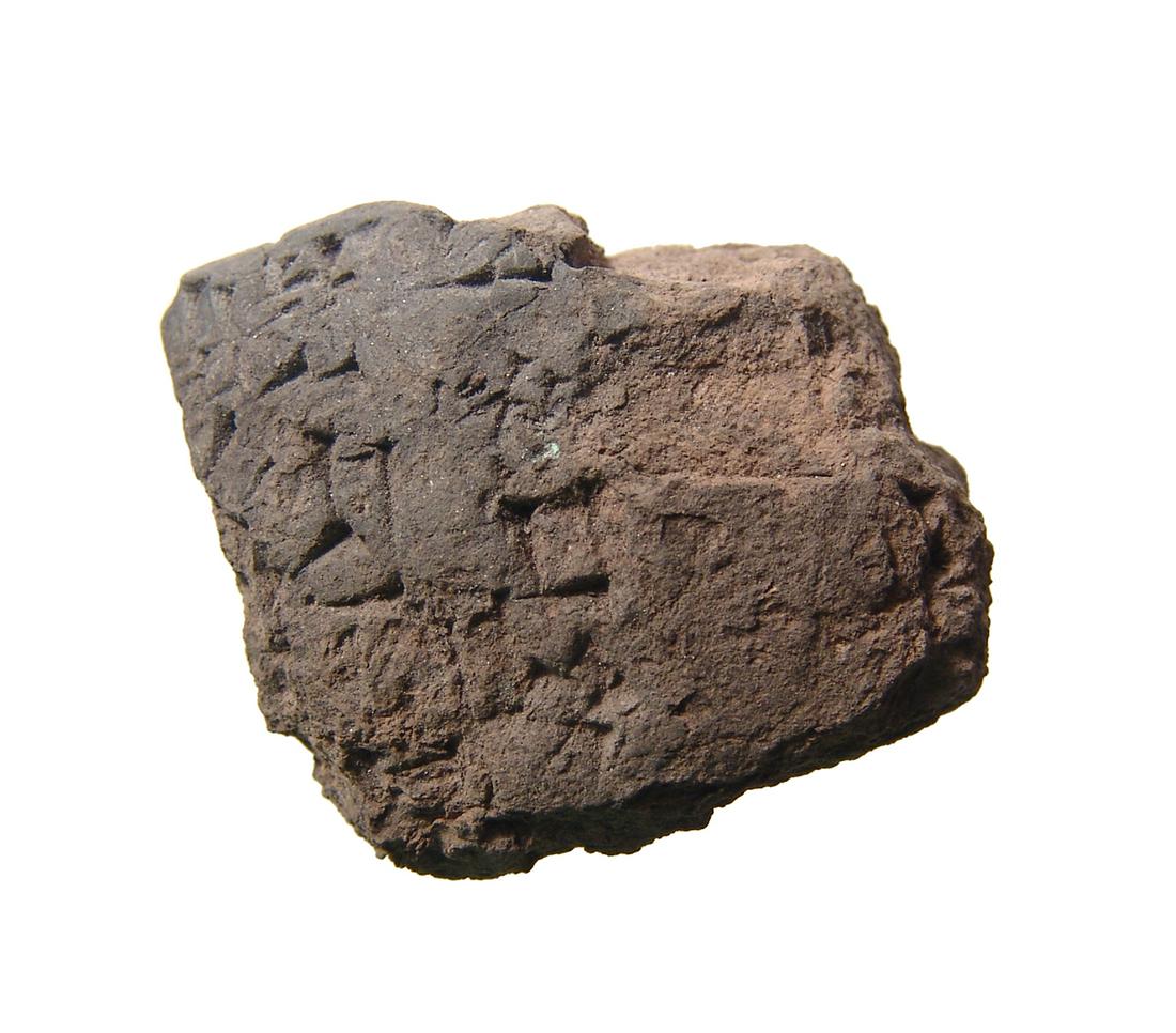 A weathered terracotta cuneiform tablet (1 of 3)