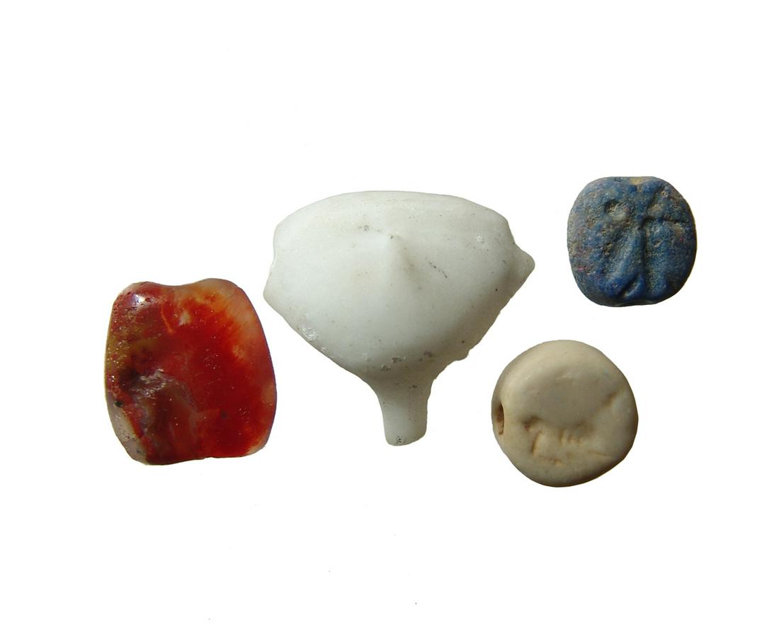 A group of 4 Near Eastern seals and stone objects (1 of 4)