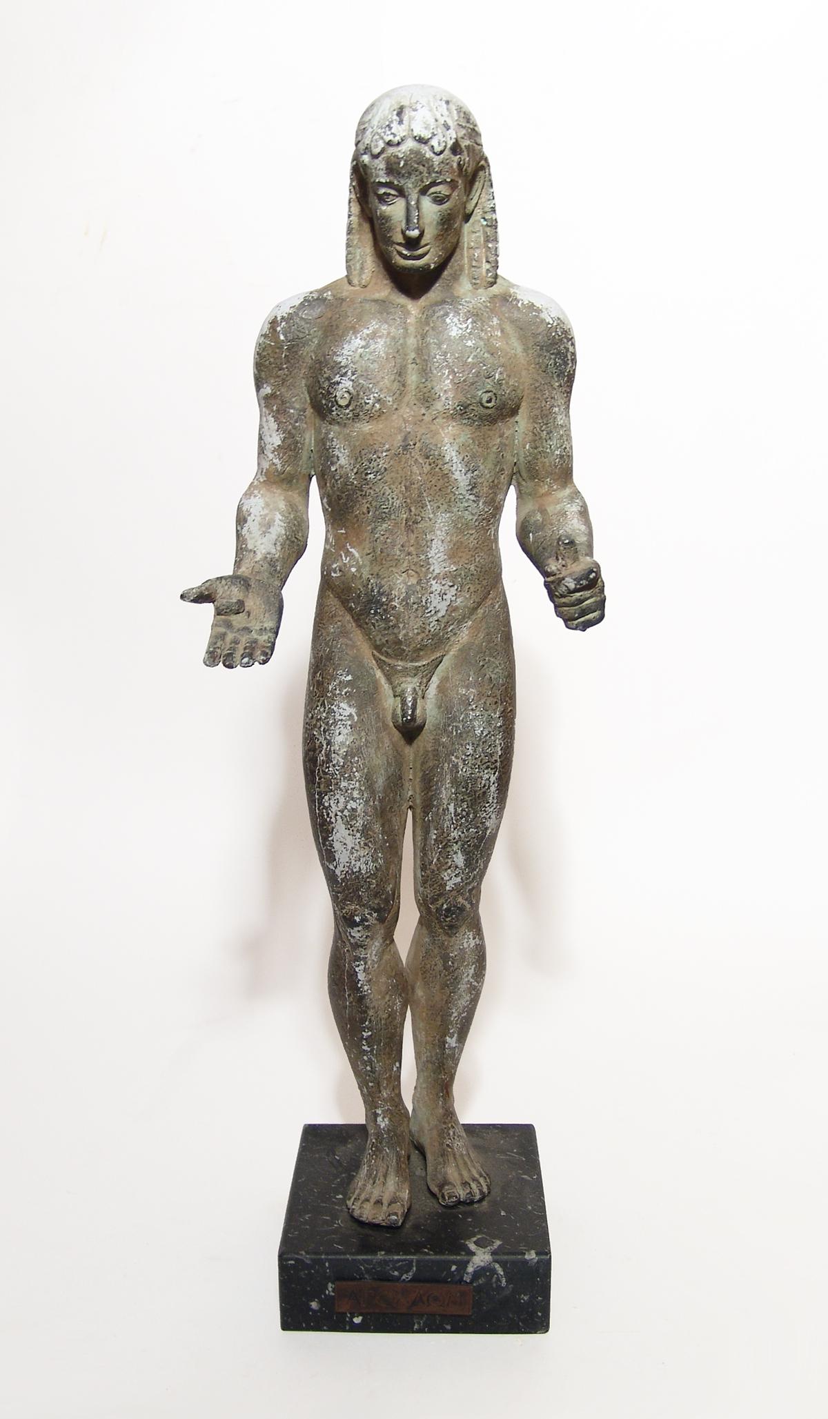 A handsome Greek replica of the Piraeus Apollo: A handsome Greek replica of the Piraeus Apollo on marble base, the original an archaic Greek style bronze work from the 6th Century BC and located at the Archaeological Museum of Piraeus (Athens). A f