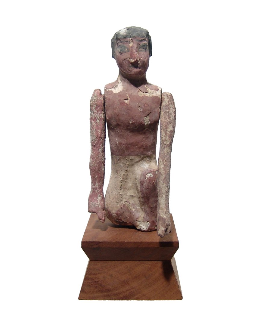 A nice Egyptian painted wood figure (1 of 3)