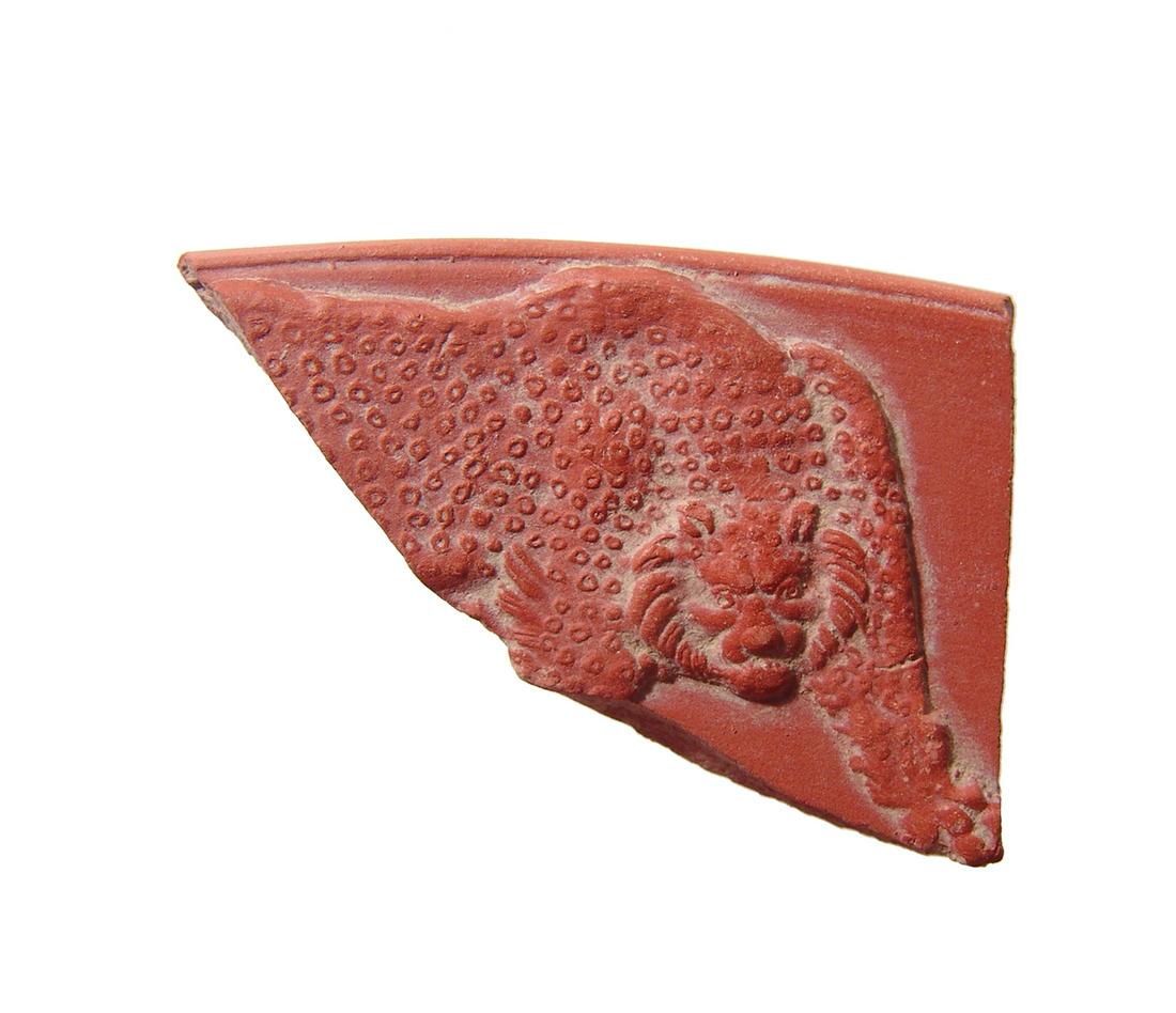 Roman red-ware pottery sherd featuring a panther (1 of 2)