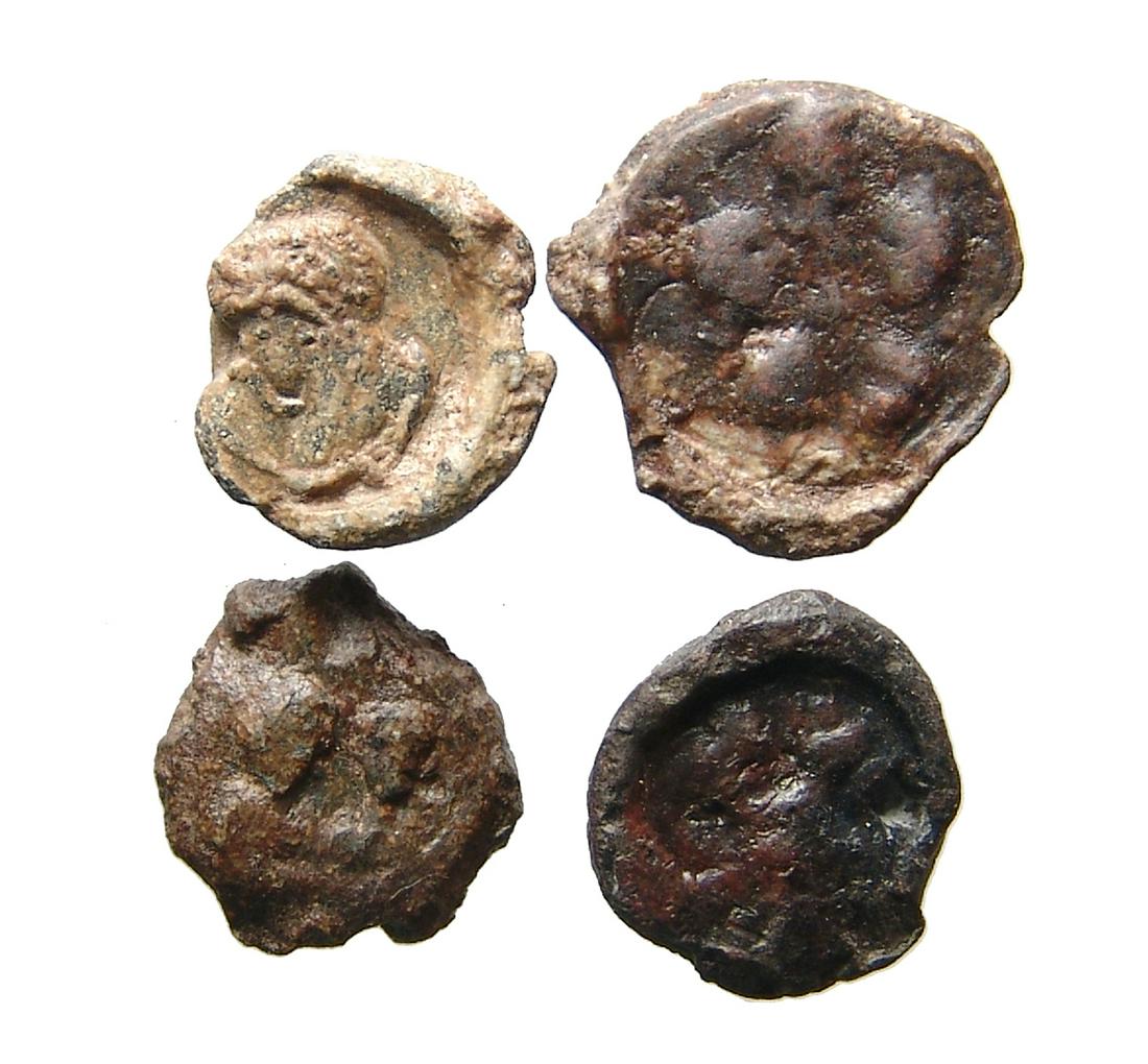 A lot of 4 Roman lead document seals or bullae: A lot of 4 Roman lead document seals or bullae. Lot includes a type with head of an emperor, 2nd - 3rd Century AD, (D: 15 mm), one with the head of an empress, 4th - 5th Century AD, with grey patina,