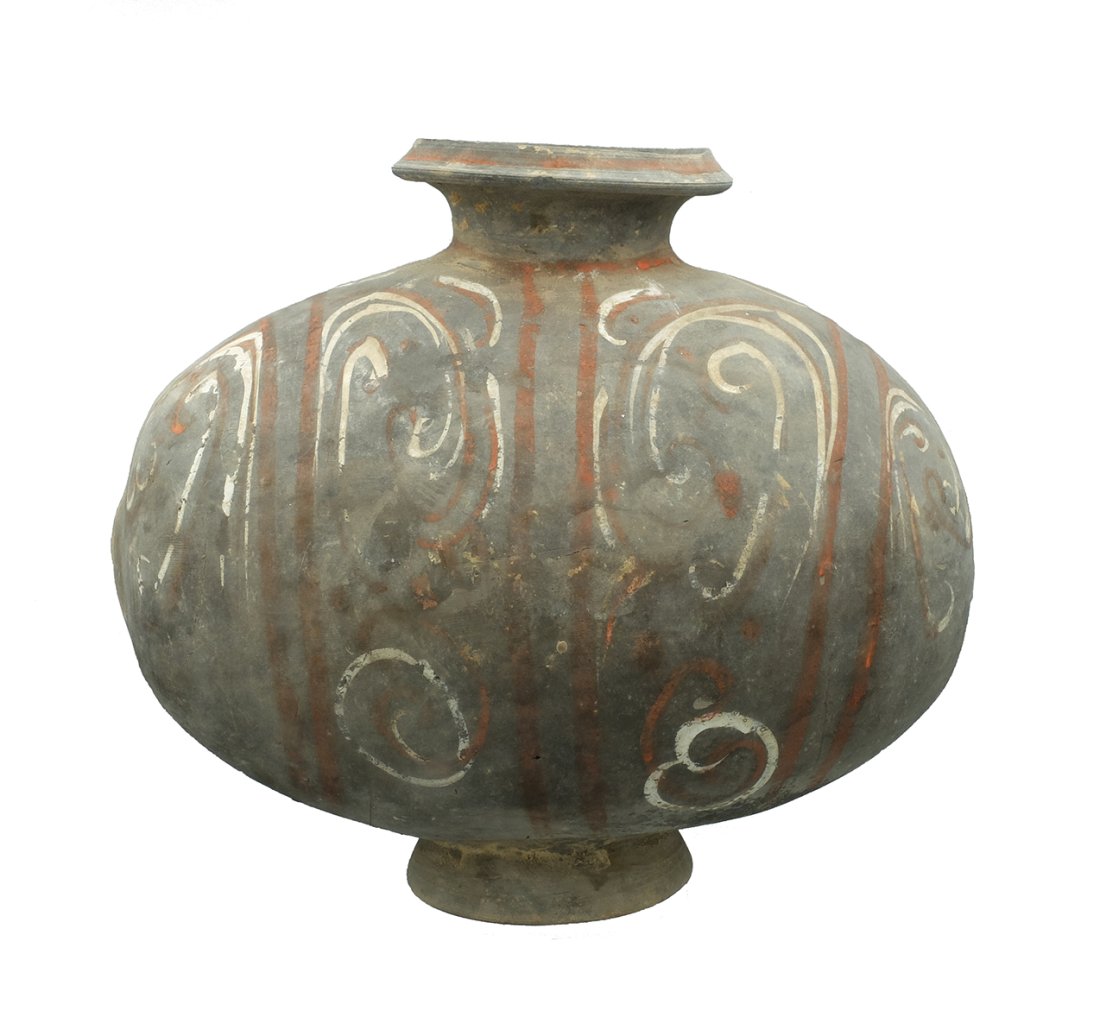 A lovely Han Dynasty polychrome cocoon vessel: A lovely Han Dynasty polychrome cocoon vessel, China, c. 206 BC - AD 220, a graceful piece, the footed pedestal base lightens the form and the short neck with the faceted rim elevates and elongates th
