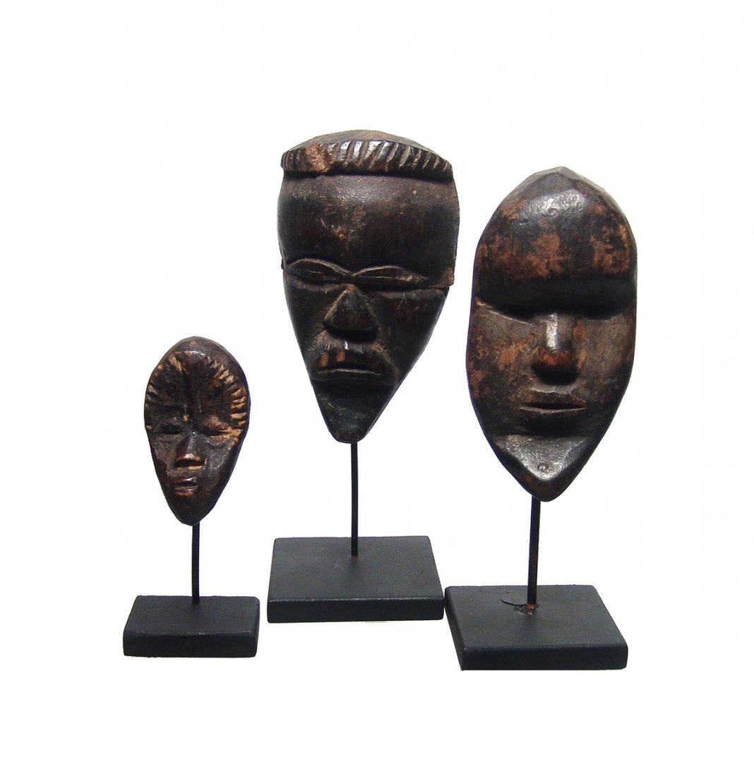 A group of three miniature Dan masks (1 of 5)