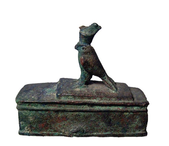 Handsome bronze falcon coffin, figure of Horus: A handsome bronze falcon coffin with figure of Horus, Late Period, c. 664 – 30 BC. Very substantial with a nicely detailed bronze figure of Horus on a rectangular base, wearing double crown. The fea