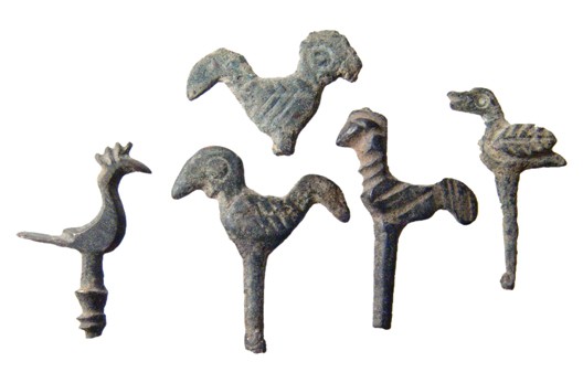 Ancient Persia. 5 Luristan bronze bird finials: A group of 5 Luristan bronze bird finials from cosmetic applicator wands, c. 1200 - 800 BC. All are nicely detailed and different. H: 32 to 35mm.