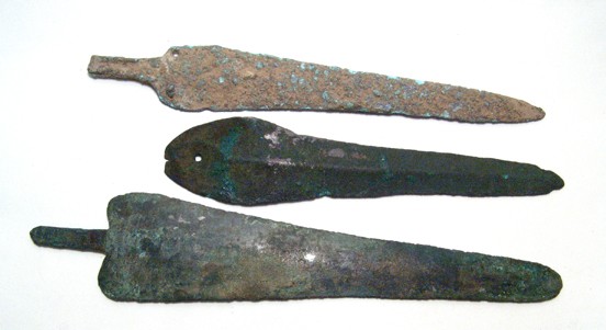 Group of 3 bronze spearheads from Central Asia: Group of 3 bronze spearheads, Central Asia, 2nd Millenium BC. Each is complete, two showing signs of longtime use and repeated resharpening, and one with thick encrustation. Two are tanged and the thi