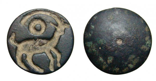 Bactrian round bronze seal with a horned goat: A nice Bactrian round bronze seal with a horned goat, Central Asia, c. 2nd Millenium BC, large circle above the animal's back. Intact, handle missing, though there is no clear indication there ever wa