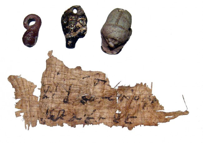 77. Egypt Papyrus fragment with Demotic script scarabs: A Ptolemaic papyrus fragment with Demotic script and two Egyptian scarabs. The papyrus fragment contains two clear lines of Demotic script in black and part of a third, Ptolemaic period, c. 3rd Centur