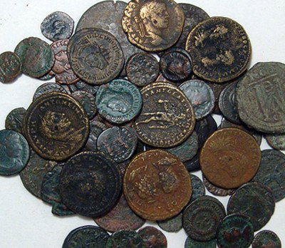 A nice lot of 50 Roman bronze coins: A nice lot of 50 Roman bronzes, larger denominations and good quality examples abound. A good mix of rulers and types including a random Greek or Byzantine coin.