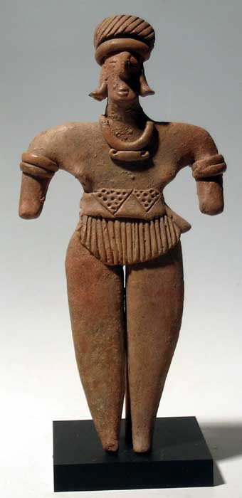 Excellent Colima figure from West Mexico: An excellent Colima figure West Mexico, c. 300 BC - AD 300. This standing male is 7 1/8" tall and is adorned with a fancy loincloth, matching headdress and extensive jewelry. Good deposits overall. Mo