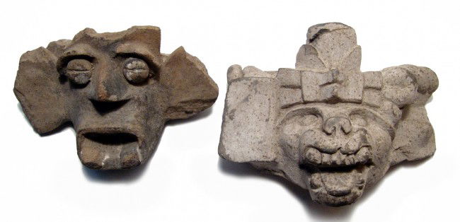 A pair of Veracruz faces from large vessels: A pair of Veracruz faces from the rims of large vessels, West Mexico, c. 300 - 100 BC. The first open mouth and two lower fangs, button eyes with horizontal slit and large brows, 5 3/4" x 3 7/8" (14.6