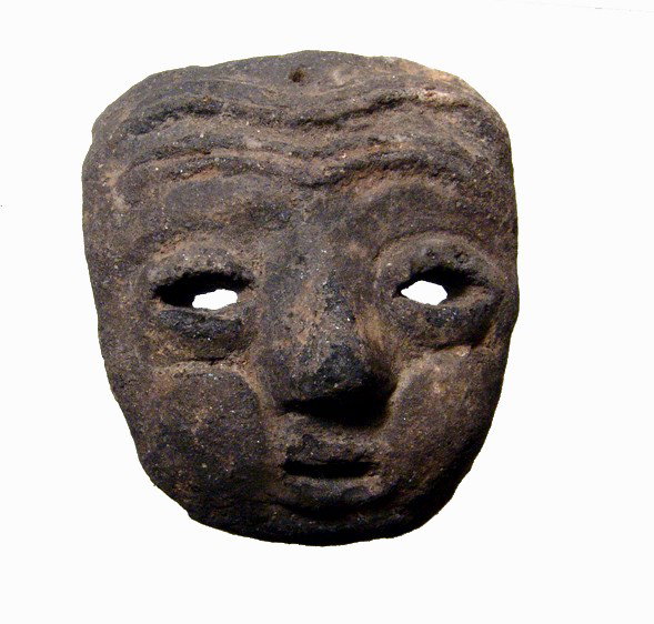 A little Narino ceramic maskette, Colombia: A little Narino ceramic maskette, Colombia, ca. AD 750 - 1,200. Intact with good earthen deposits. Small suspension hole at top. 2 7/8" x 2 1/2" (7.3 x 6.4 cm). Ex Florida collection.