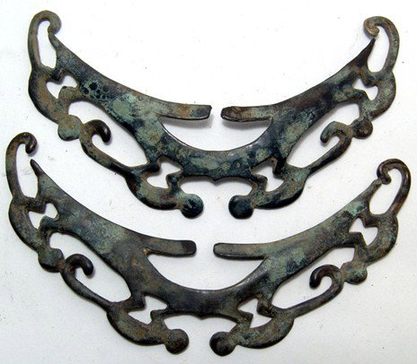 Pair of Narino copper nose rings, Colombia: A pair of Narino copper nose rings, Colombia, ca. 1000 - 1500, decorated with four spider monkeys climbing, each behind another. Largest 5 1/2" (14 cm) wide. Each is intact. Ex East Coast collection.