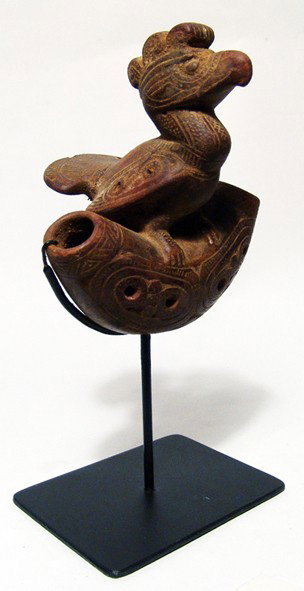 Tairona bird ocarina from Colombia: A lovely Tairona bird ocarina, Colombia, ca. AD 1000 - 1500, with detailed workmanship and in perfect working order. The entire piece is covered with flowing incised geometric designs and is mounted o