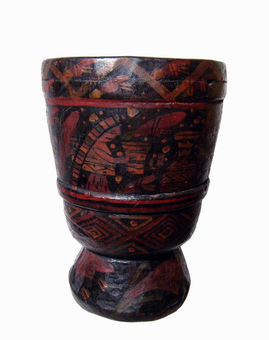 Inca Colonial wooden kero, painted decoration: An Inca Colonial wooden kero with painted decoration, Peru, 1700 - 1800. The vessel is hewn from a solid piece of wood, the inside with unfinished surfaces on the lower portion. The outside is decorat