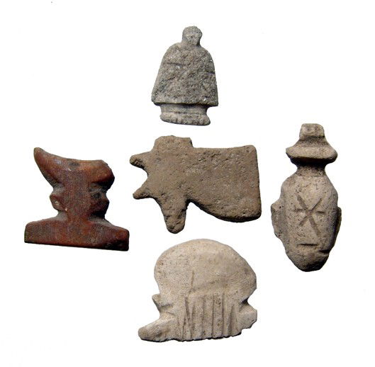 Lot of 5 Egyptian stone amulets: A lot of 5 stone amulets, Late Period, c. 664-30 BC. Group includes a "Menichet" or "comb" amulet which guarantees clothing in the afterlife, a Wedjat or "eye of Horus amulet, an "ib" or amulet of the
