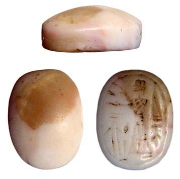 Marble domed stamp seal, Near East: A pinkish marble domed stamp seal, Near East, c. 2nd Millennium BC, depicting a worshipper before an altar. Some wear from use and pierced lengthwise for suspension. 17 x 13mm. Ex Cecil Best collectio