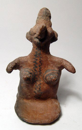 A Nice Jalisco Terracotta Figure of a Woman: A Jalisco terracotta figure of a woman, West Mexico, AD 1 – 250, her features stylized, arms shortened and held outwards from her body. The red slip is well preserved with concentric circles in blac