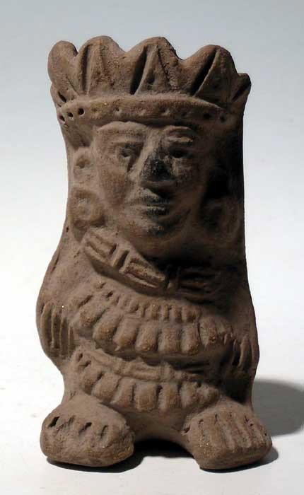 Fine Toltec molded figural incensario from Mexico: A fine Toltec molded figural incensario from Mexico, c. AD 800-1000. This mold-made example depicts an ornately attired individual wearing a complex headdress and extensive clothing. The small chamber