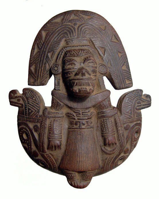 Tairona ocarina of a seated deity, Colombia: A lovely Tairona ocarina in the form of a seated deity, Colombia, c. AD 1000-1500, the entire piece decorated incised geometric designs, an elaborate serpent head to either side. Intact and in perfect