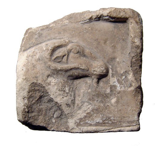 Limestone relief depicting the head of Khnum: A partial limestone relief depicting the head of Khnum, Late Period, c. 664 - 30 BC. From the upper right corner of a larger relief one side possesses the head of the god Khnum, showing nice detail an