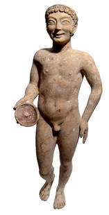 Very large Greek terracotta figure of a youth: A very large Greek terracotta figure of a youth, Probably 5th Century BC, nude, holding a phiale (patera) in right hand, left hand at his hip. Hollow molded, the figure wears a tight-fitting cap, hair