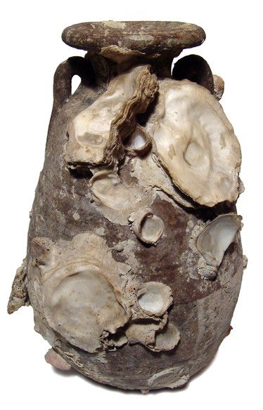 Roman terracotta amphora w. marine encrustation: A Roman terracotta amphora with marine encrustation, c. 3rd - 5th Century AD, the upper portion in black slip over a crme body. Intact with heavy marine encrustation including oysters and other small