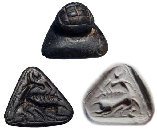 Black steatite stamp seal w. horned goat, Syria: A black steatite stamp seal with horned goat, Syria, 2nd Millennium BC. An attractive seal with knob handle decorated with incised lines. On the base, a running horned goat, looking back with a palm-f