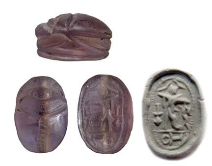 Choice Phoenician Glass scarab: A choice Phoenician Glass scarab, 2nd Millennium BC, the body nicely carved in a naturalistic style. On base, an Egyptian style god with open wings amongst hieroglyphic characters, some stylized, an '