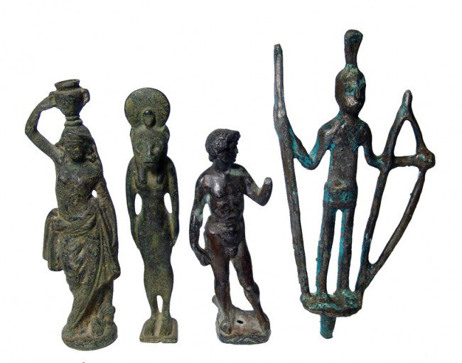 Grand Tour. Group of 4 Egyptian bronzes: A group of 4 antique bronzes including a nice figure of the Egyptian goddess Sekhmet, a Roman-type figure of a woman with a jar on her head, a figure of the famous "David", and a more tribal looking f