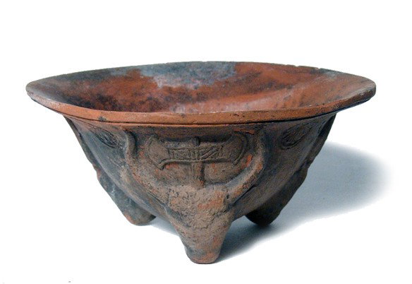 Grand Tour. Minoan/Mycenaean bull-head bowl: A terracotta bowl with molded bull heads, Minoan/Mycenaean in style, double-axes between the horns. Nicely detailed with rosettes between the bulls some blackish coloration throughout. Inside the bowl