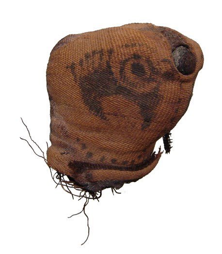 Roman Egypt, falcon mummy linen head: An interesting linen modeled head from the mummy of a falcon, Roman Period, c. 30 BC - AD 395, the core made from resin-soaked linen with an outer covering showing nicely painted details. H: 2 1/2" (6