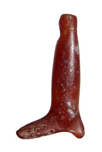 Old Kingdom carnelian foot/leg amulet: A nice carnelian amulet in the form of a foot with unbent leg, Late Old Kingdom - 1st Intermediate Period, c. 2170 - 1980 BC, nicely detailed with attractive desert varnish. Holed at top for suspensio