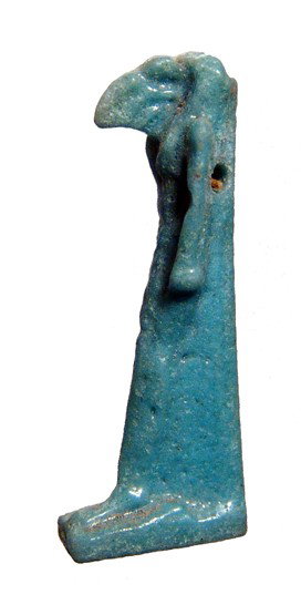 Brilliant turquoise faience amulet of Thoth: A brilliant turquoise faience amulet of Thoth, Late Period, c. 664 - 30 BC, showing excellent details and preservation. Intact with near perfect glaze. H: 30mm. Ex English private collection.