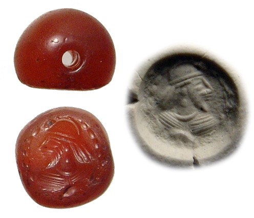 Sasanian carnelian stamp seal with male bust: An attractive Sasanian carnelian stamp seal with male bust, c. AD 224 - 650, bearded and wearing a diadem; all within a dotted border. W: 11mm. Ex Los Angeles private collection.