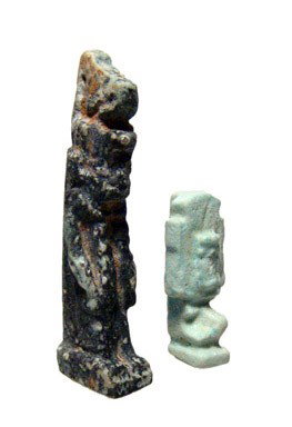 Egypt. Pair of faience amulets, Neith and Shu: A pair of faience amulets, the goddess Neith and Shu the sky god, Late Period, c. 664 - 30 BC. The amulet of Neith depicts her wearing the red crown and suckling a crocodile with each breast, H: 2" (5