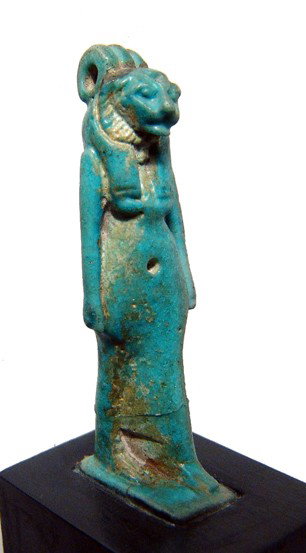 Choice faience amulet of a lion-headed goddess: A choice blue faience amulet of a lion-headed goddess, Late Period, c. 664 - 343 BC, wearing tripartite headdress and close-fitting gown. Her features are well detailed and the entire amulet is well-p