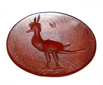 Sasanian carnelian intaglio with a peacock: A nice carnelian intaglio with a peacock, Sasanian, 3rd - 4th Century AD. The bird stands to the left and is handsome rendered. Intact. 10 x 12mm. Ex Los Angeles collection.