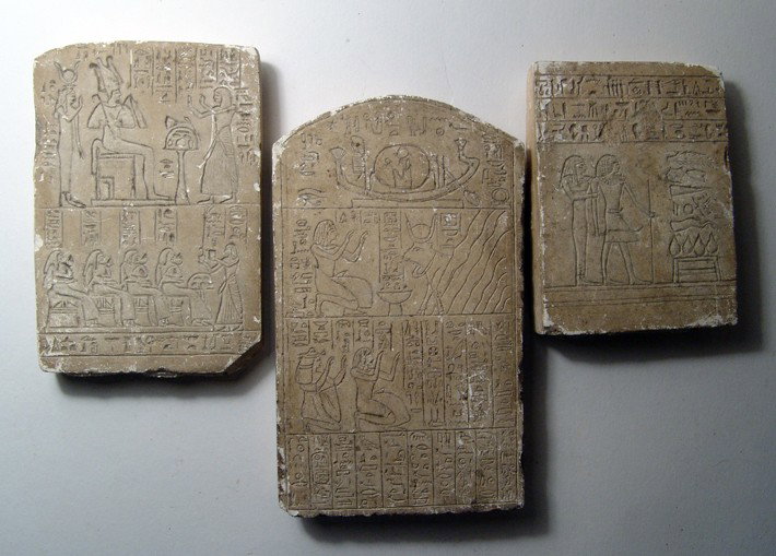 Lot of 3 antique incised Egyptian stele: A lot of 3 antique incised Egyptian stele, early 20th Century, each with crisp details. Some minor chipping and remains old mounting on the back of each. Largest measures 5 3/4" x 3 1/4" (13.4 x 8.3 c